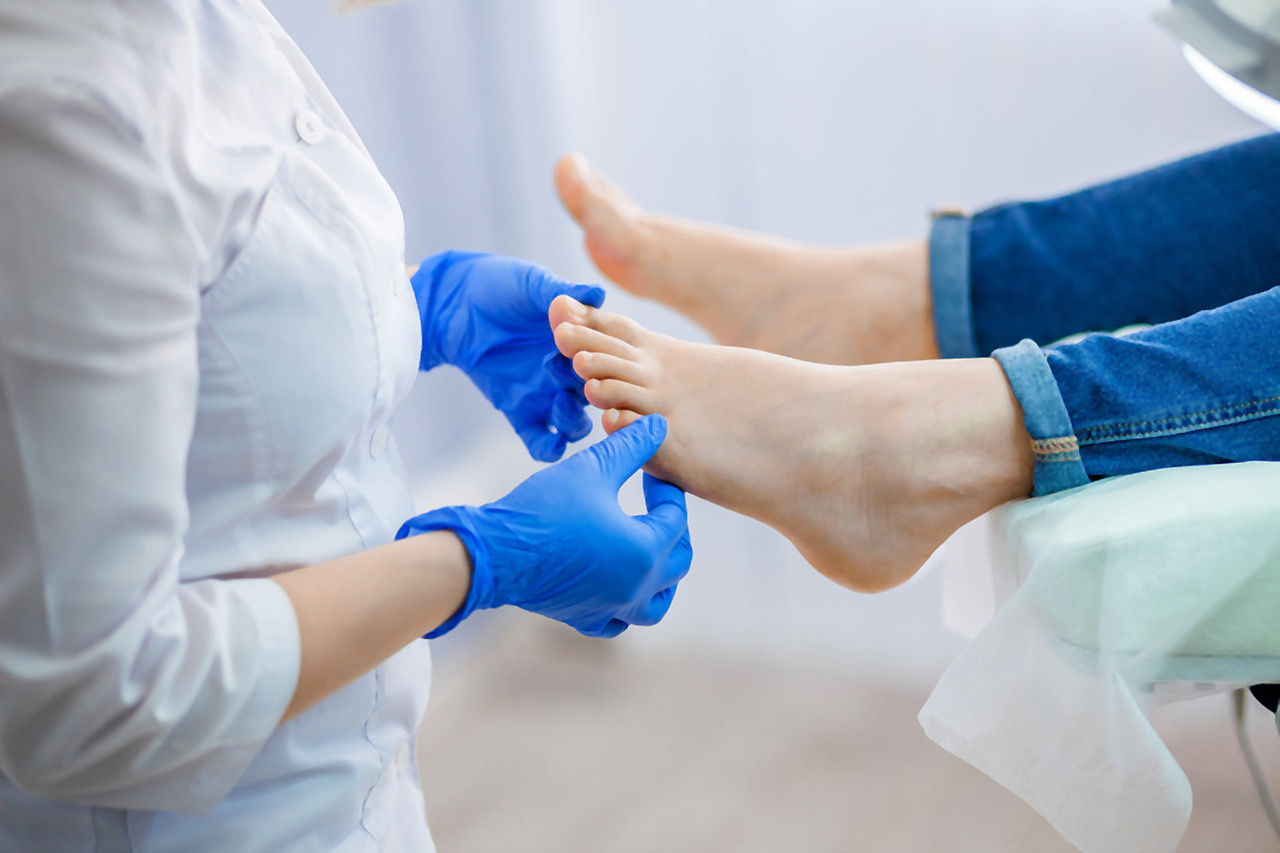 Podiatry doctor examines the foot